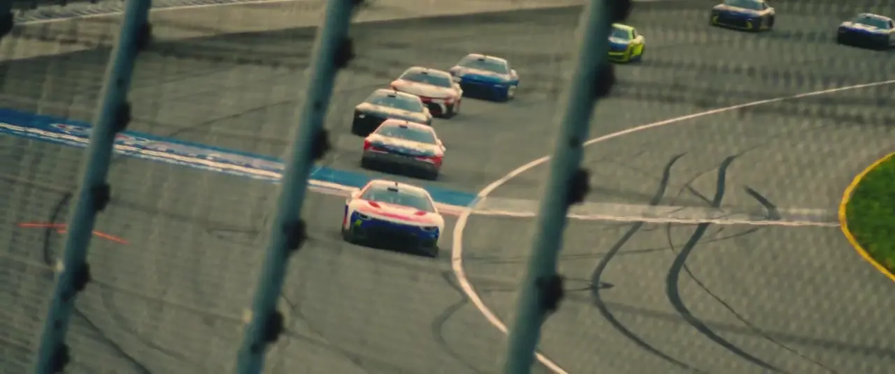 A NASCAR field running through a banked turn at Chicagoland Speedway